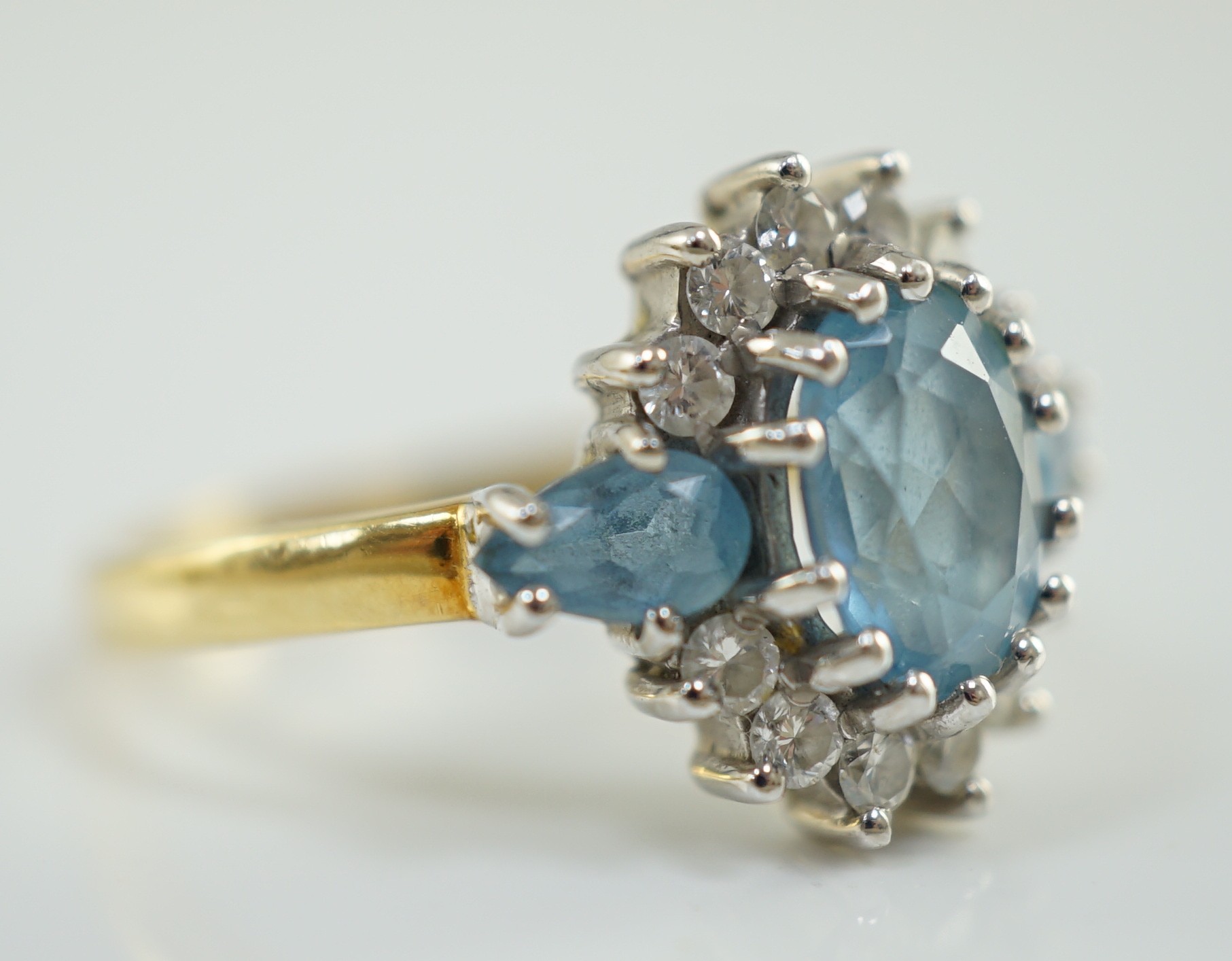 A 1970's 18ct gold, aquamarine and diamond set oval cluster ring, by Cropp & Farr